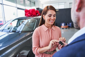Women getting keys to new car