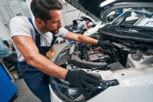 man removing air filter